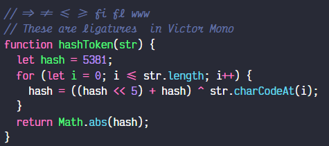 Victor Mono monospaced coding font showcasing cursive italic comments and programming ligatures in a JavaScript snippet.